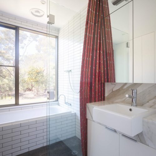 Opat Architects Couryard House Somers bathroom with brick curtain screen